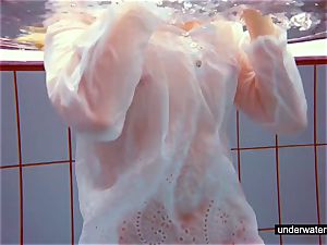 lovely red-haired plays naked underwater